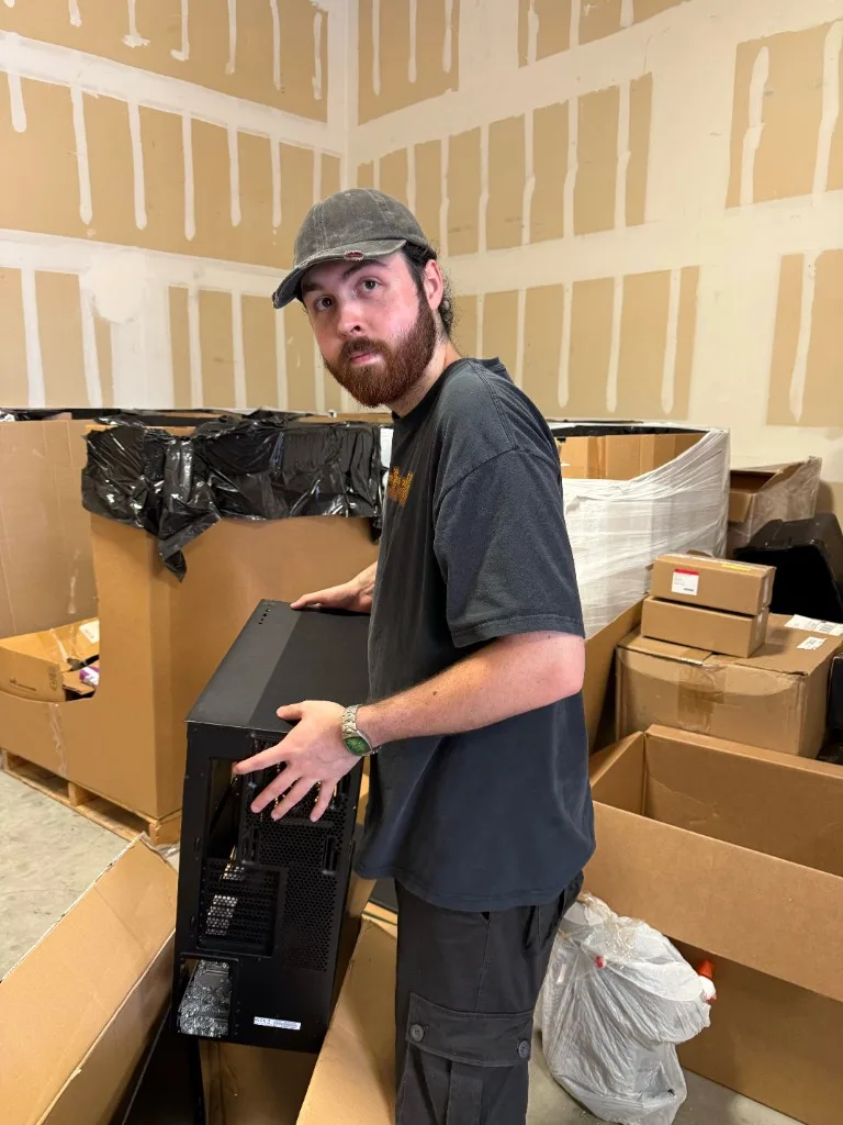 Trevor handling liquidation inventory on the warehouse floor